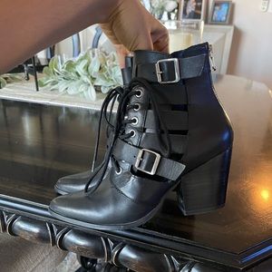 Black tie strappy Steve Madden booties.